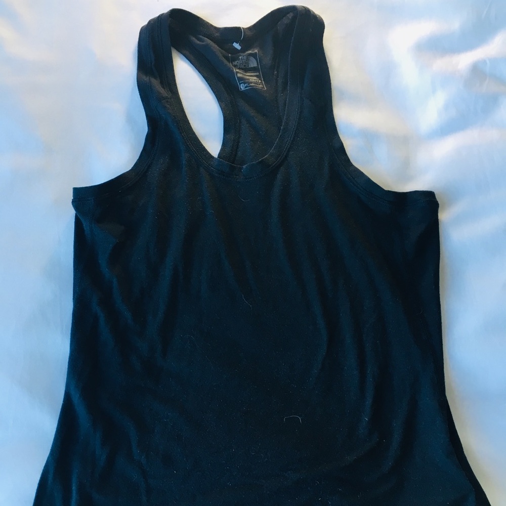 Black exercising north face tank top